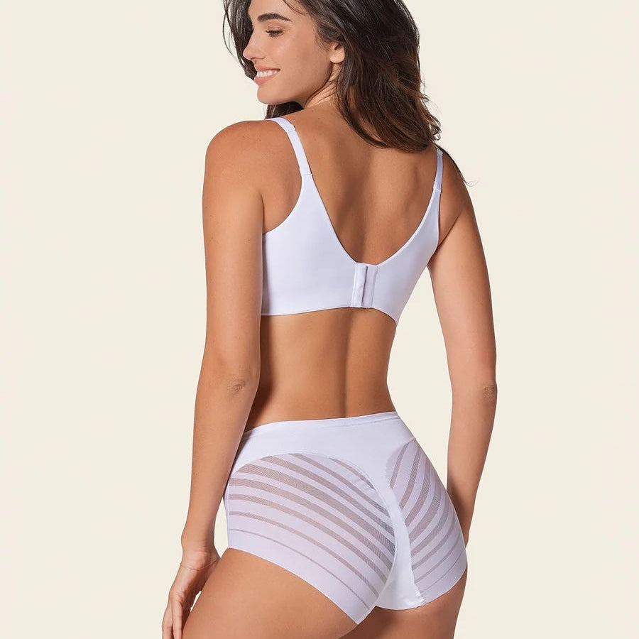 Woman wearing a light purple bikini set on a beige background