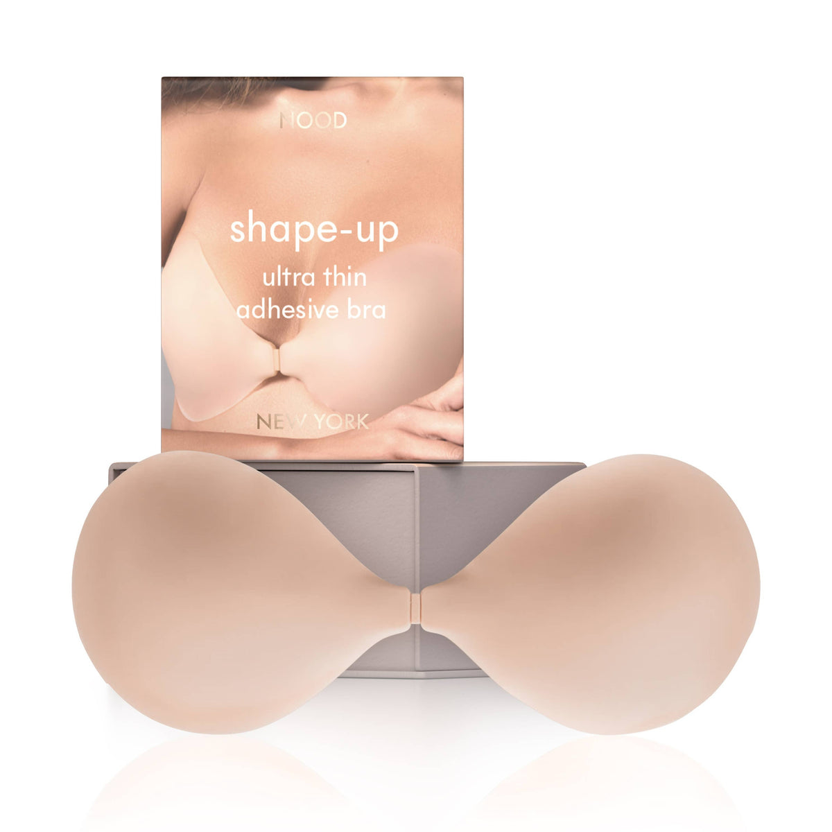 N shaped adhesive bra with packaging on a white background