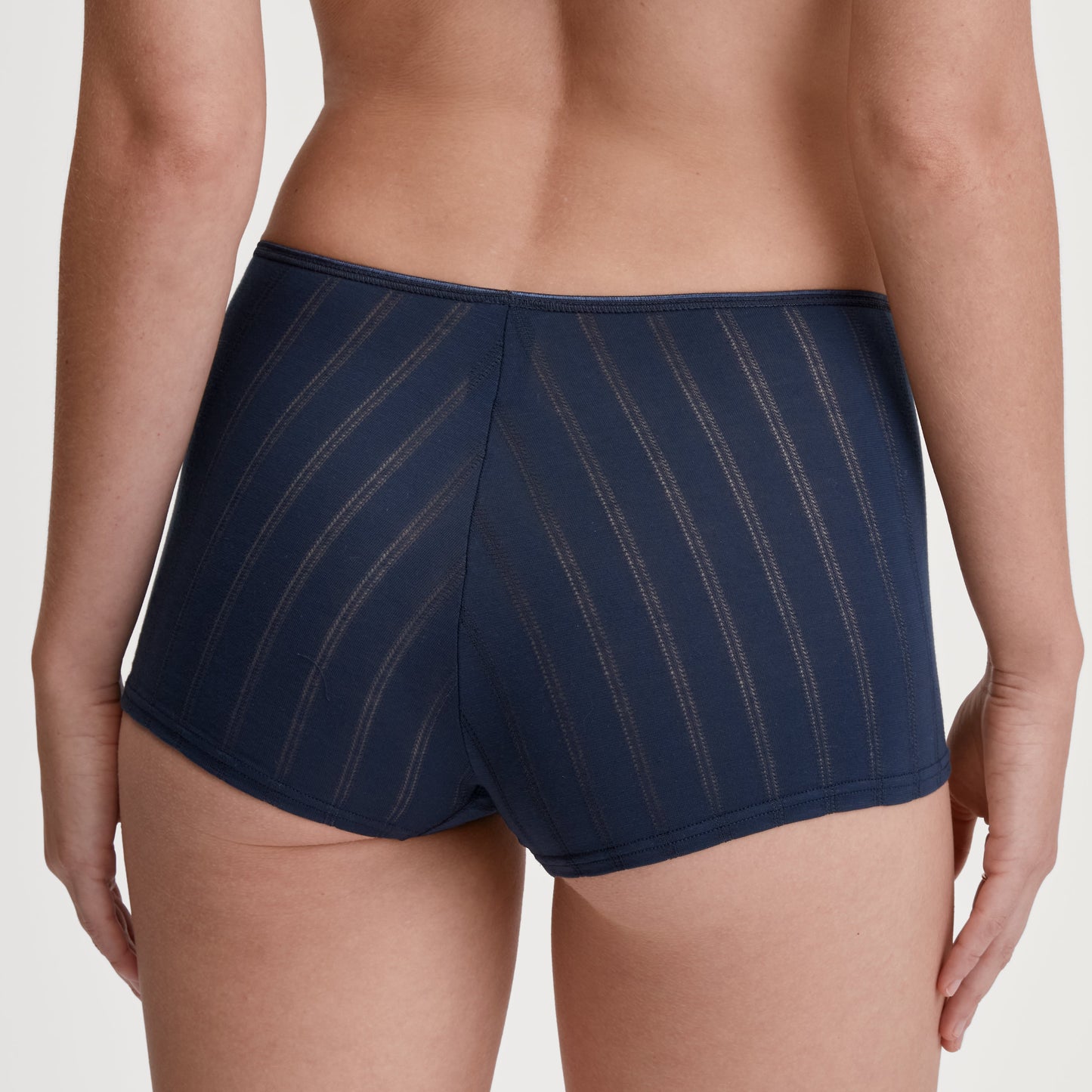 Navy underwear on a plain background