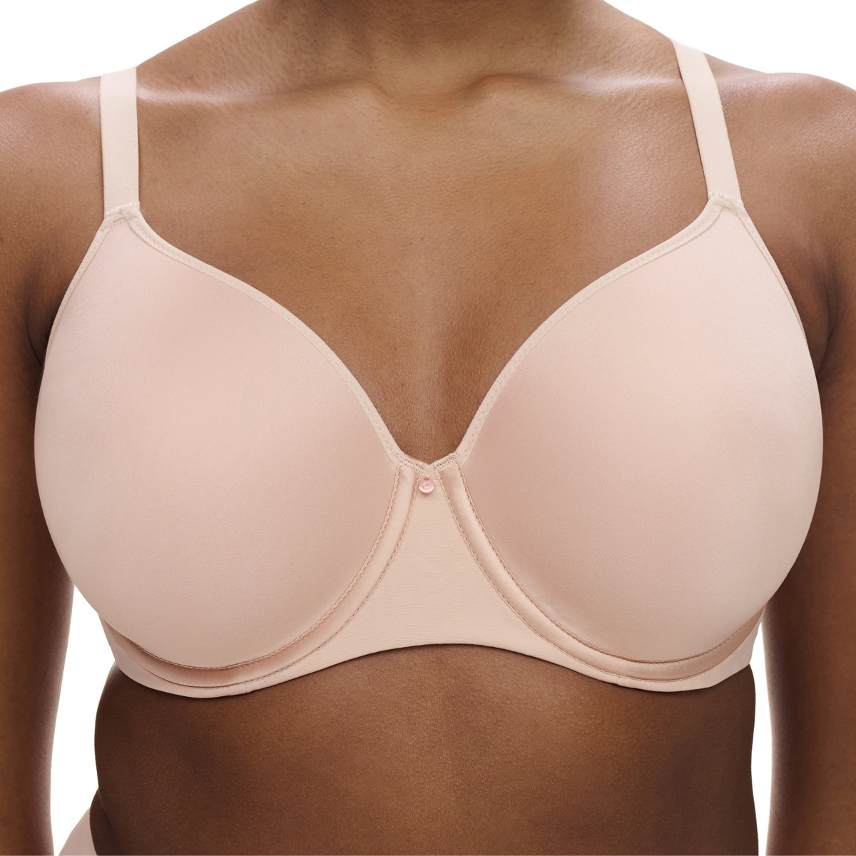 Beige bra on a model with a white background