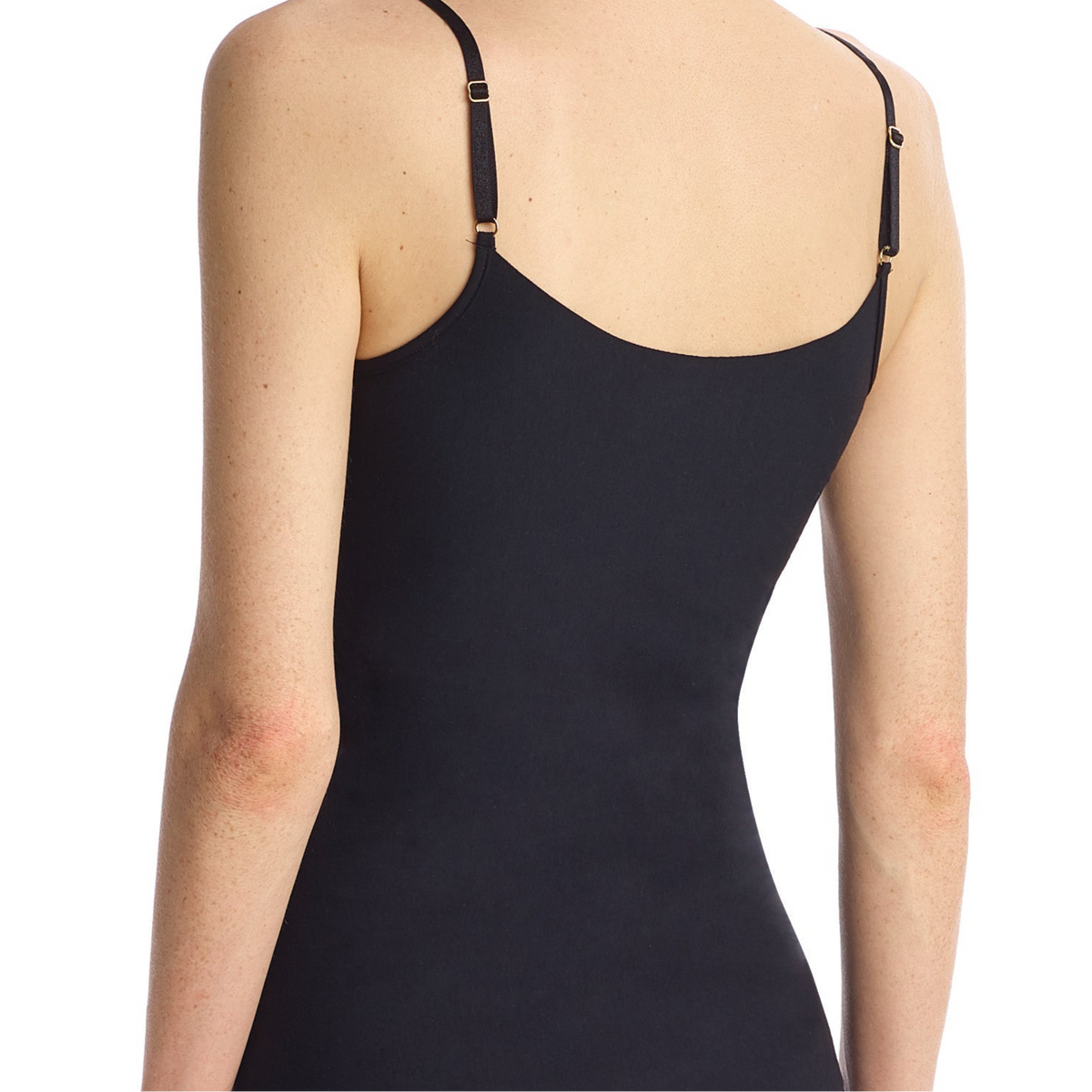 Black bodysuit worn by a person on a white background