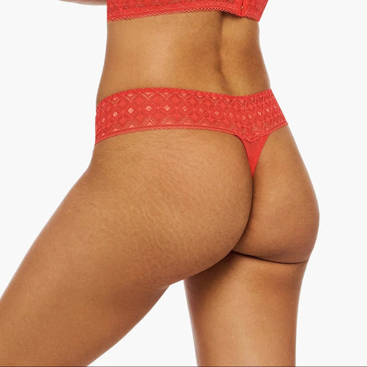 Woman wearing a red bikini on a white background