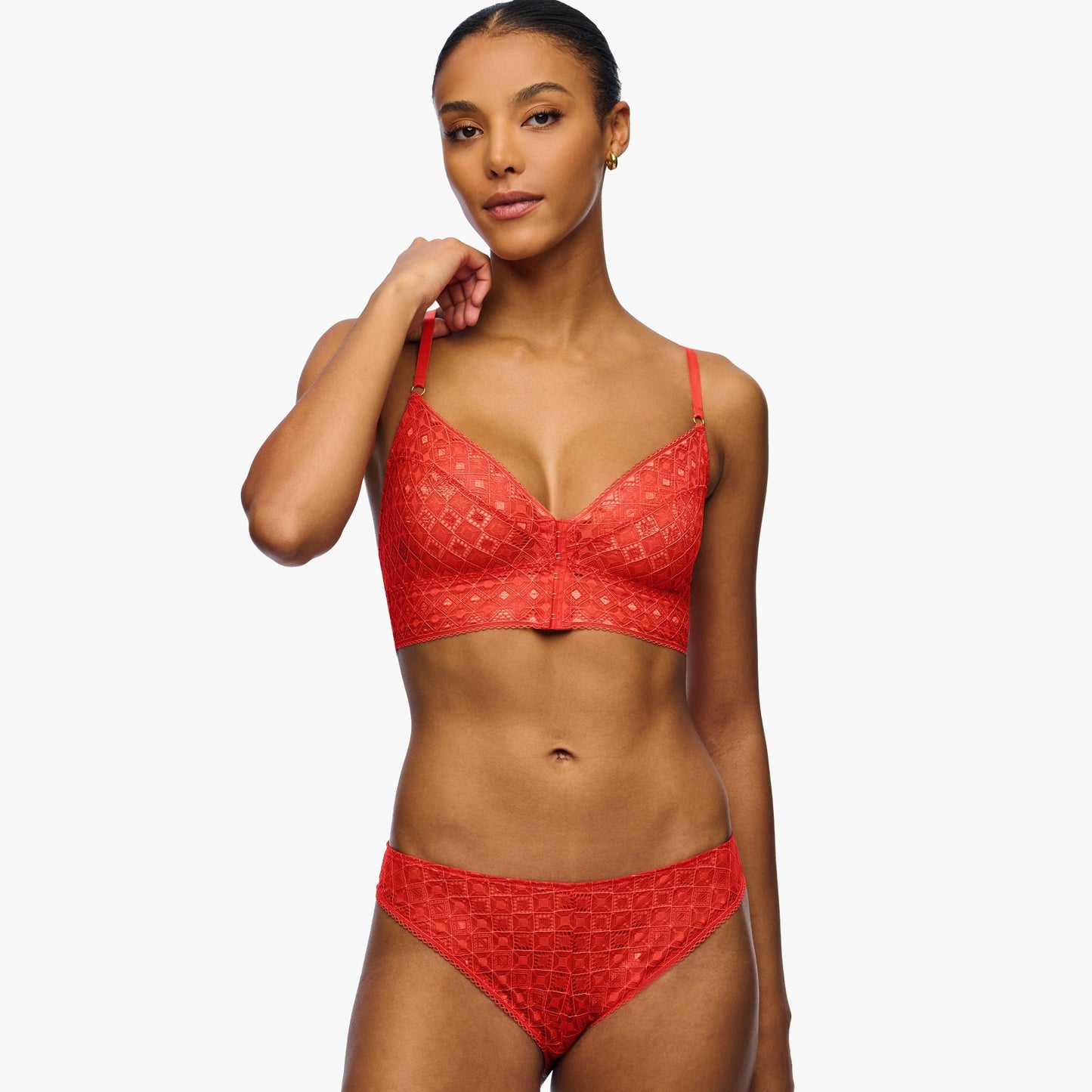 Woman wearing a red bikini set on a white background