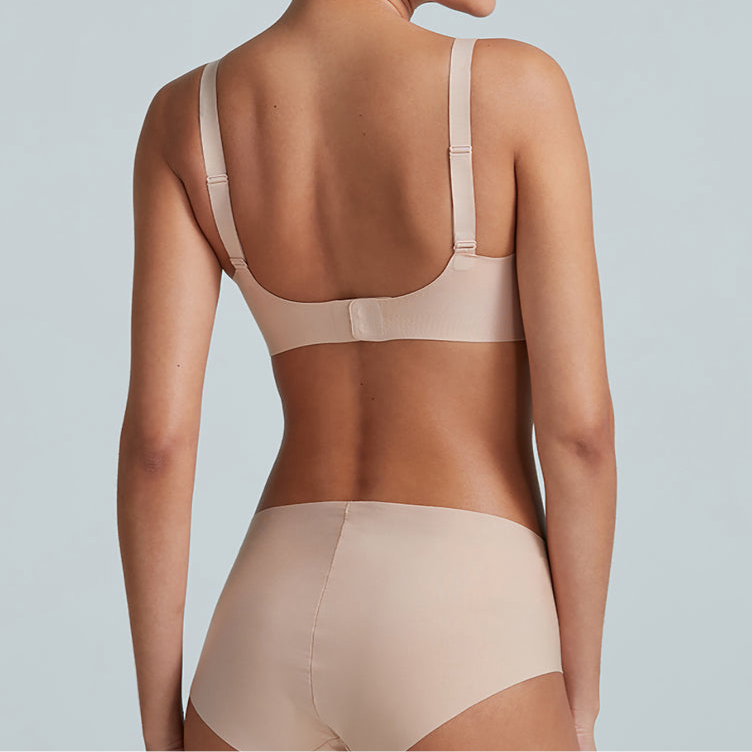 Beige shapewear on a plain background