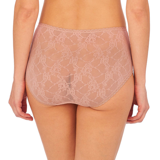 Lace underwear worn by a person on a white background