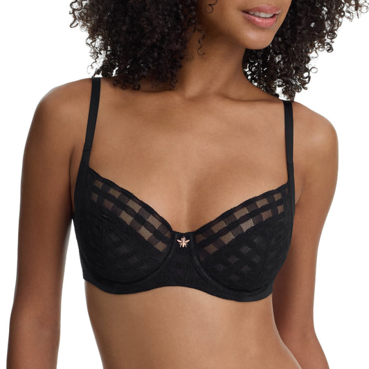 Black bra with mesh details worn by a model on a white background