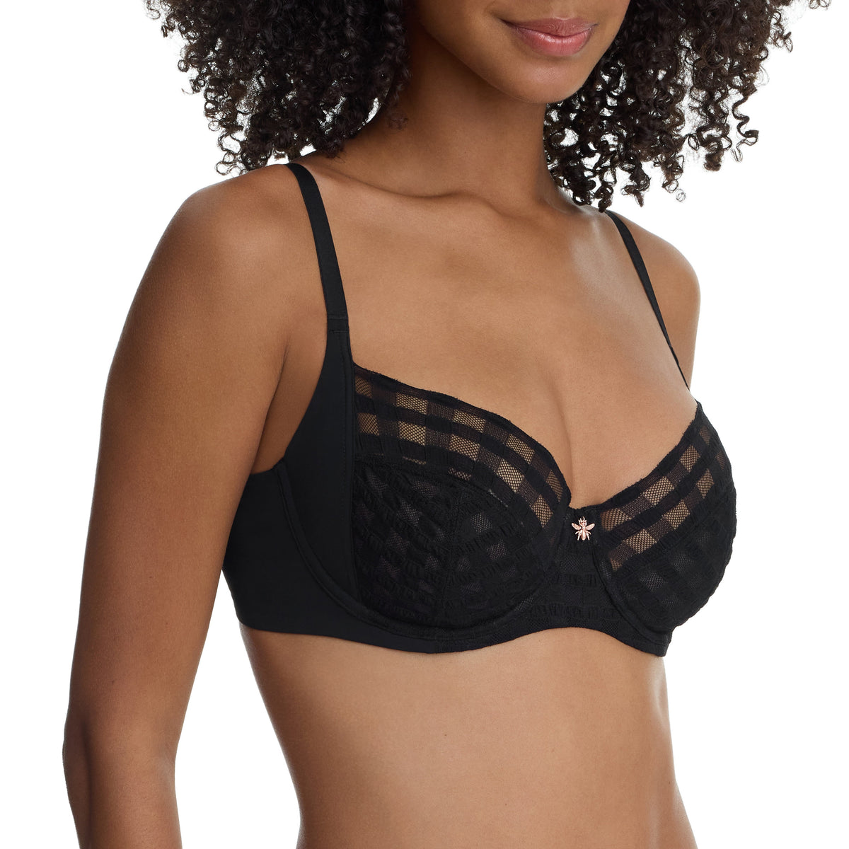 Black bra worn by a model on a white background