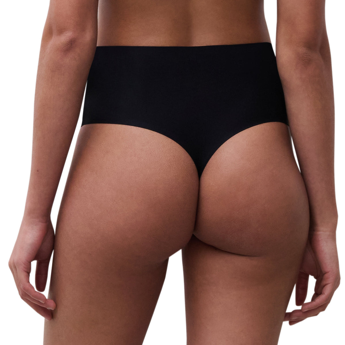 Black underwear worn by a model on a plain background