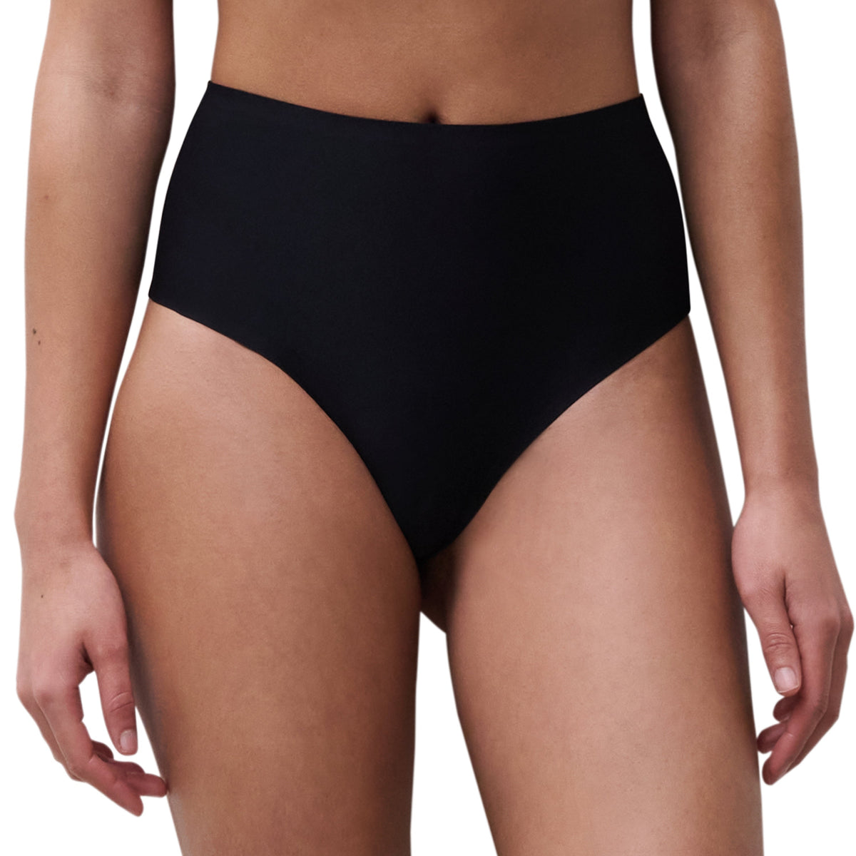 A high-cut beige thong underwear with seamless leg openings and coverage at the back.