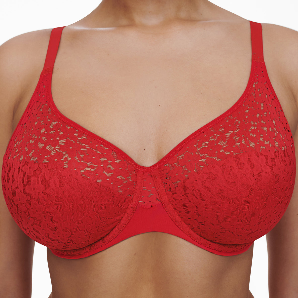 A poppy red underwire bra with floral details, modeled on a person facing frontally.