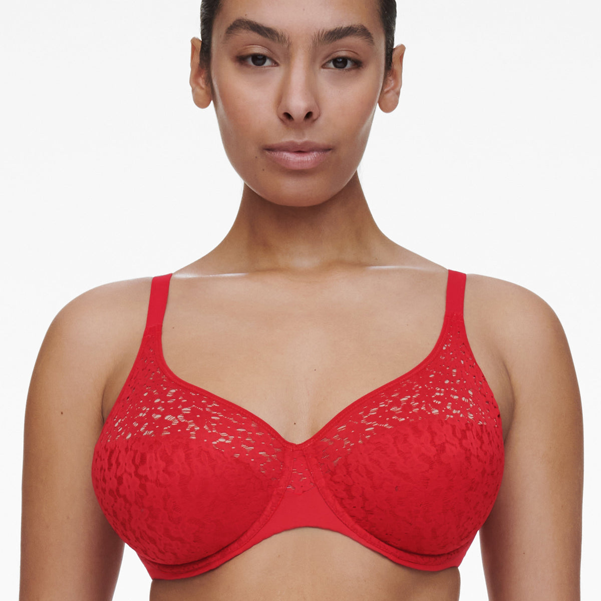 Red bra worn by a model on a white background