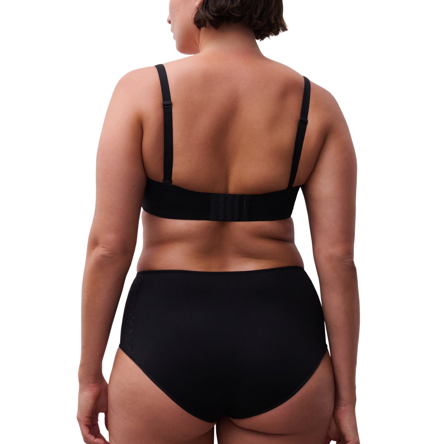 Person wearing a black bikini set on a white background