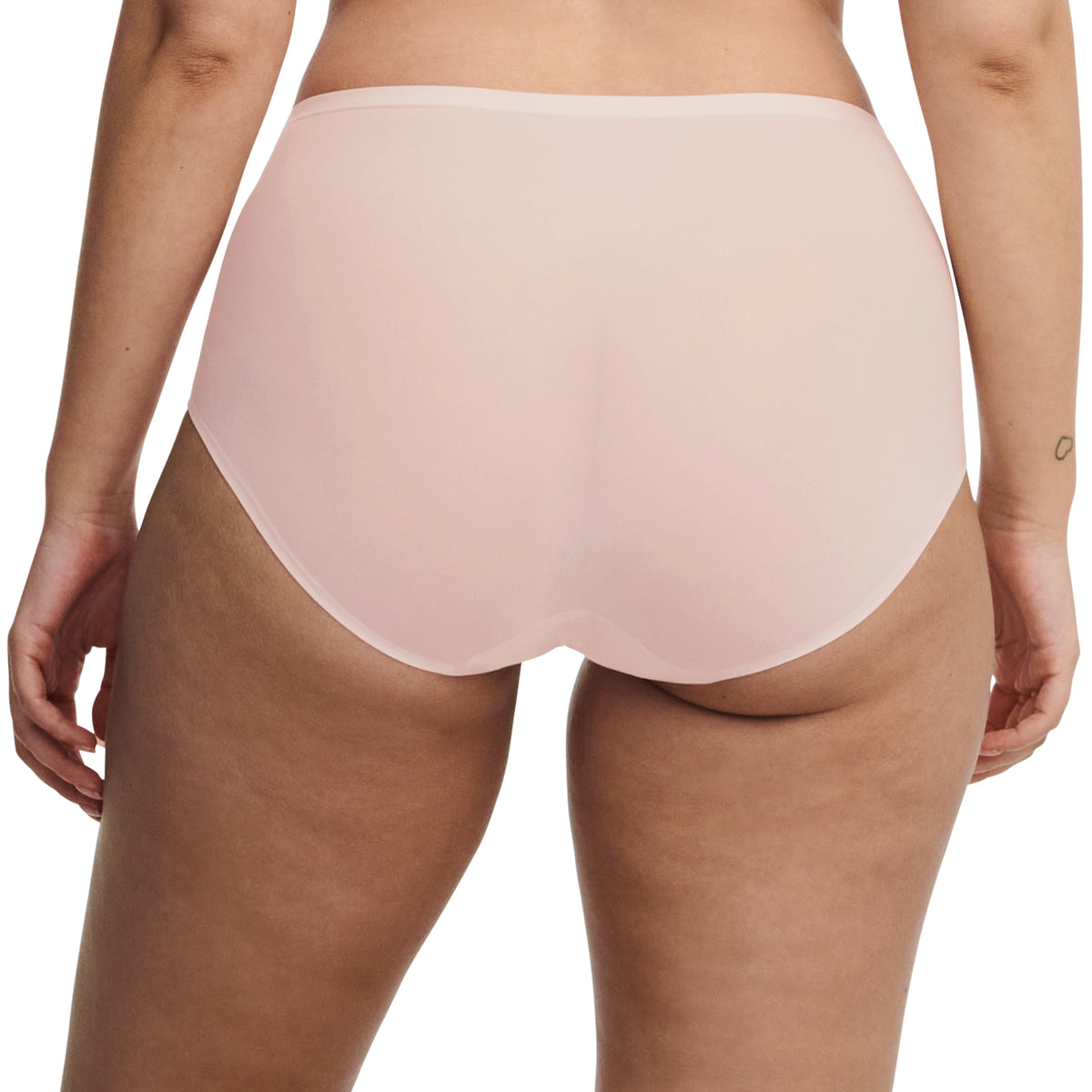Beige high-waisted underwear on a plain background
