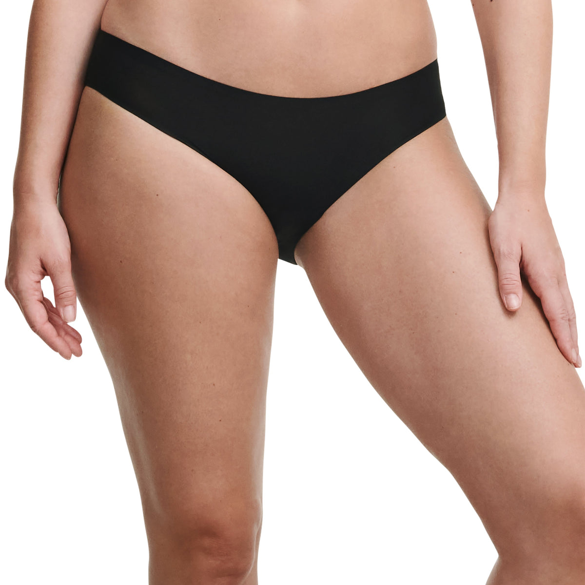 Person wearing black underwear on a white background