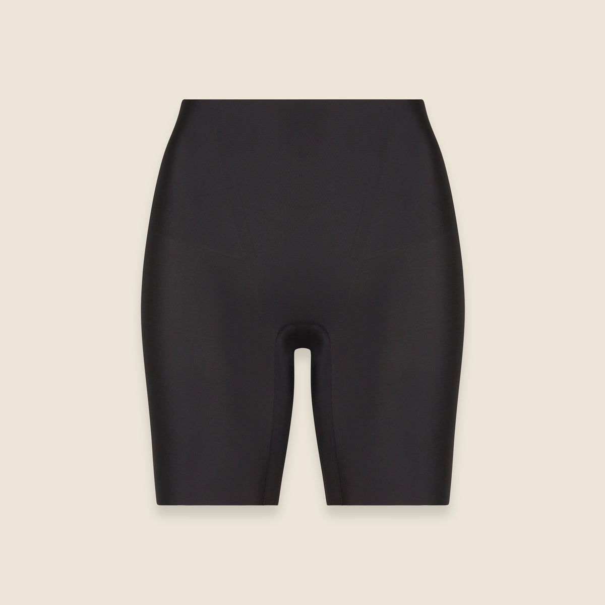 Black shorts on a beige background