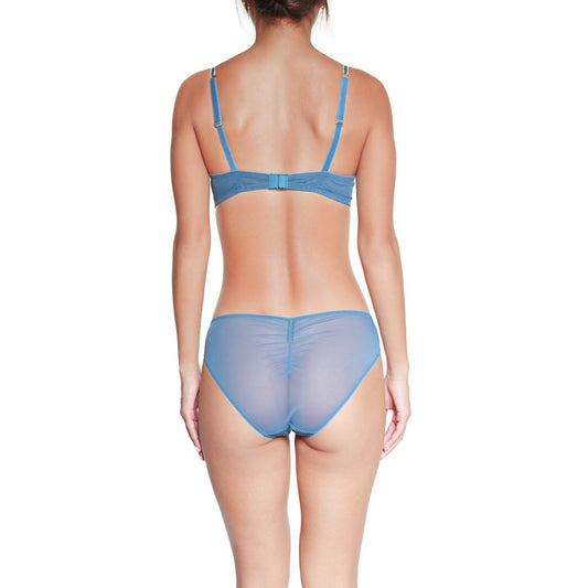 Person wearing a blue lingerie set on a white background