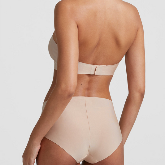 Beige high-waisted bikini bottom on a plain background