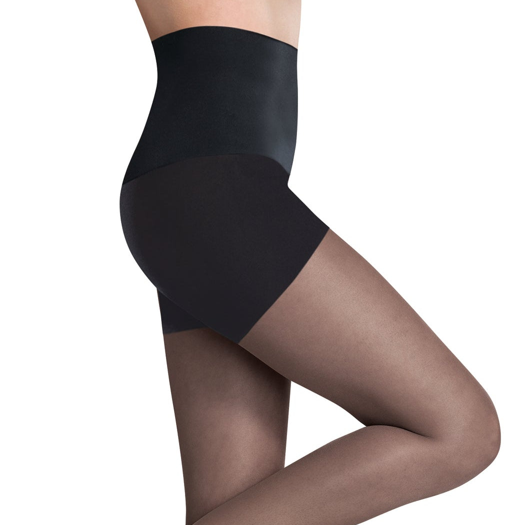 A side view of a person wearing sheer black control top tights and high heels, showcasing the smooth leg finish and high waistband.