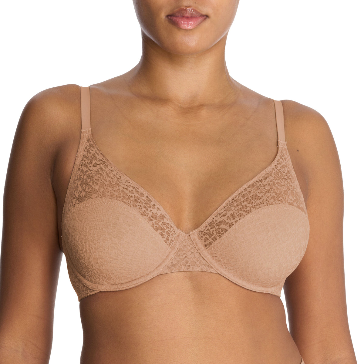A woman wearing a beige, full fit smoothing underwire bra with lace detailing.