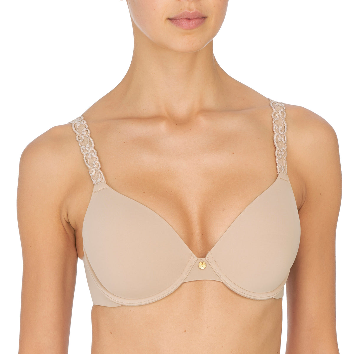 Beige bra with lace trim worn by a model on a white background