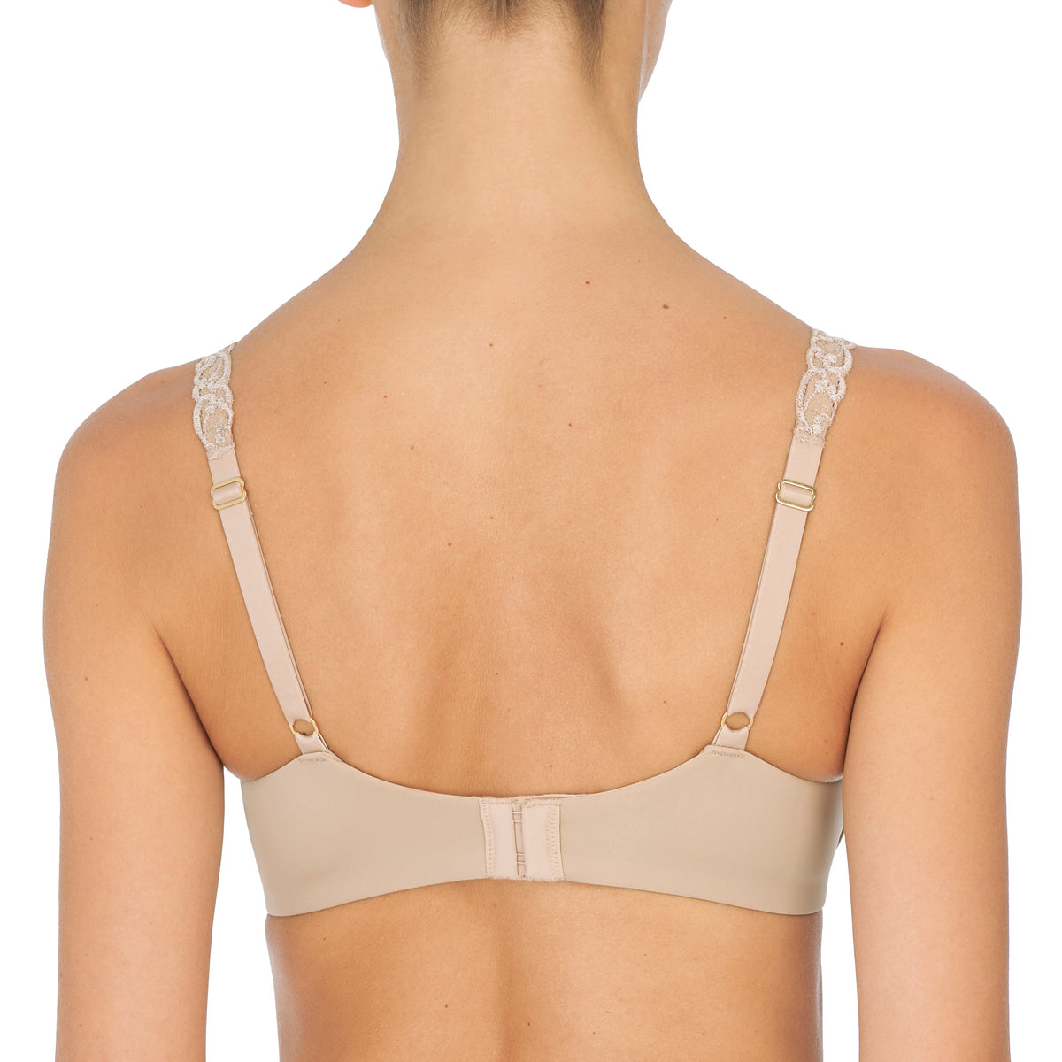 Beige bra worn by a model on a white background