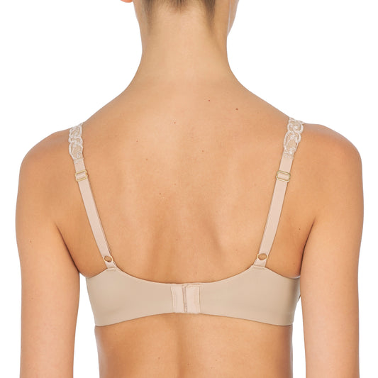 Beige bra worn by a model on a white background