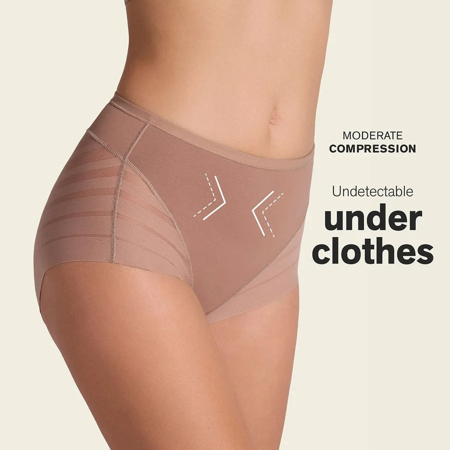 A model's lower torso wearing high-waisted compression underwear in a nude beige color, with white graphic overlays indicating moderate compression and the text 'Undetectable under clothes' on a light beige background.