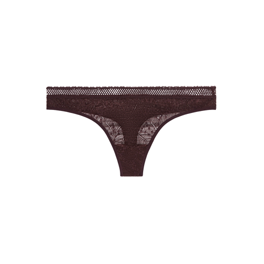 Brown thong with lace details on a white background