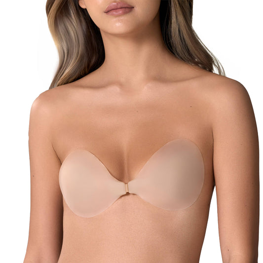 Beige strapless bra worn by a model on a white background