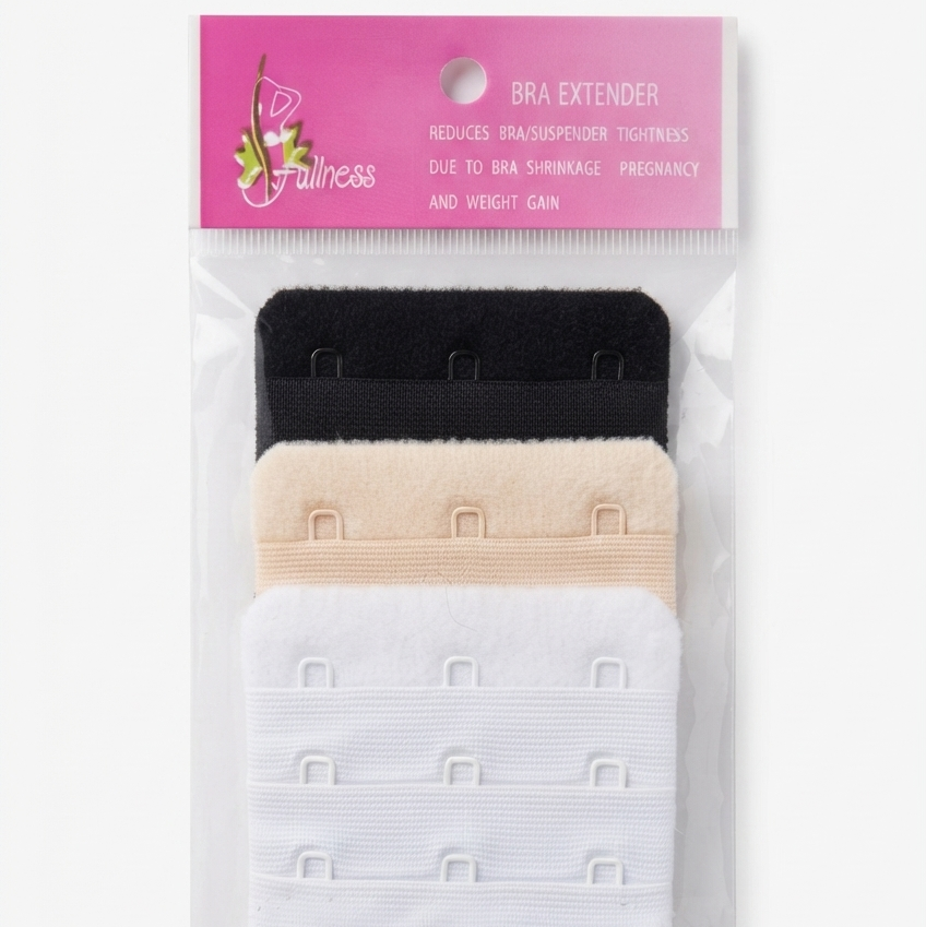 A packaged bra extender set with three adjustable hook-and-loop bands in black, beige, and white, attached to a pink header card labeled 'Bianca' and 'Bra Extender'.