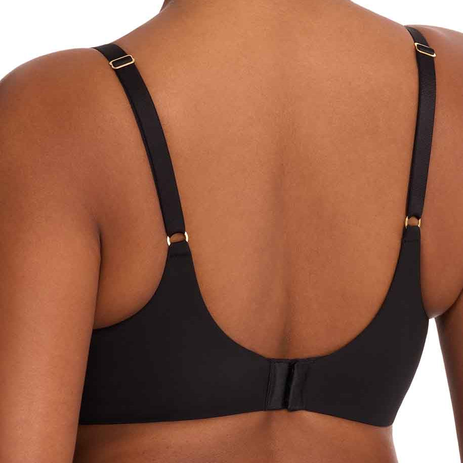 Rear view of a model wearing a black bra with adjustable shoulder straps and small gold-tone metal rings, shown against a plain white background.