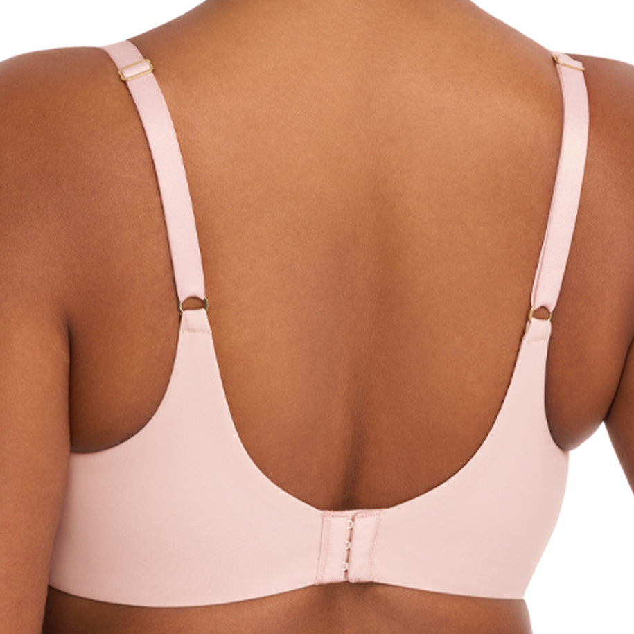 Light pink bra worn by a model on a white background