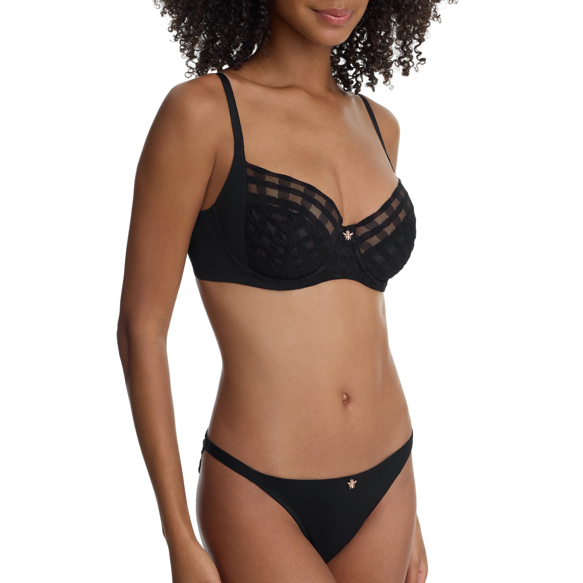 Woman wearing a black bikini set on a white background