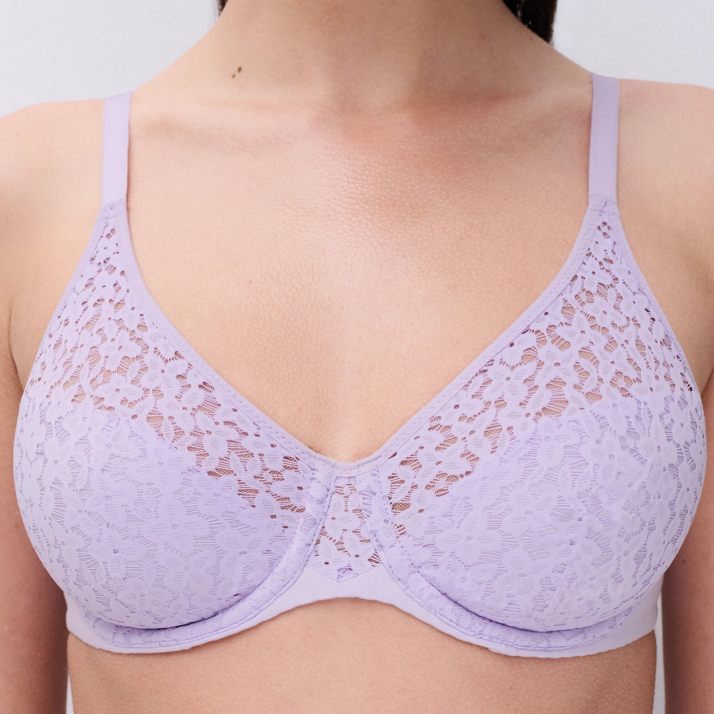Lavender lace bra on a plain background