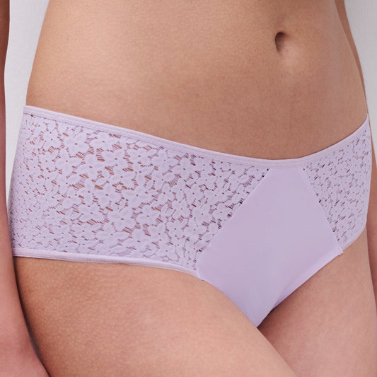 Lavender lace underwear on a plain background
