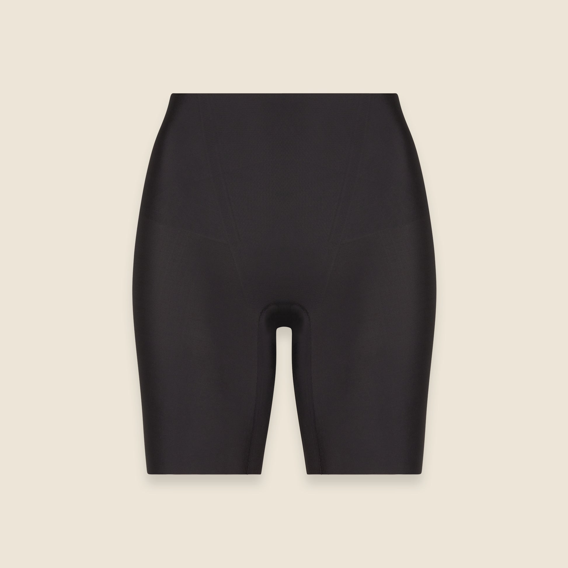 Black shorts on a beige background