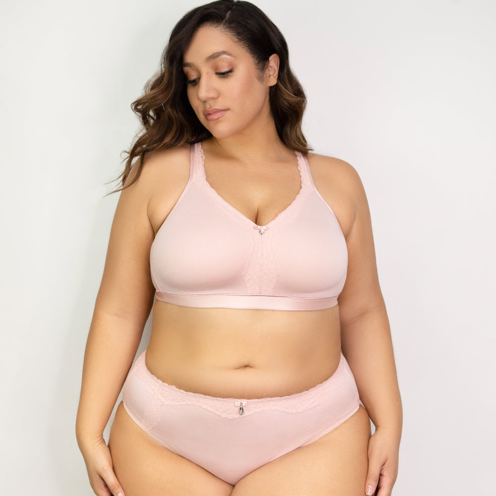 Woman wearing a pink bikini set against a plain background