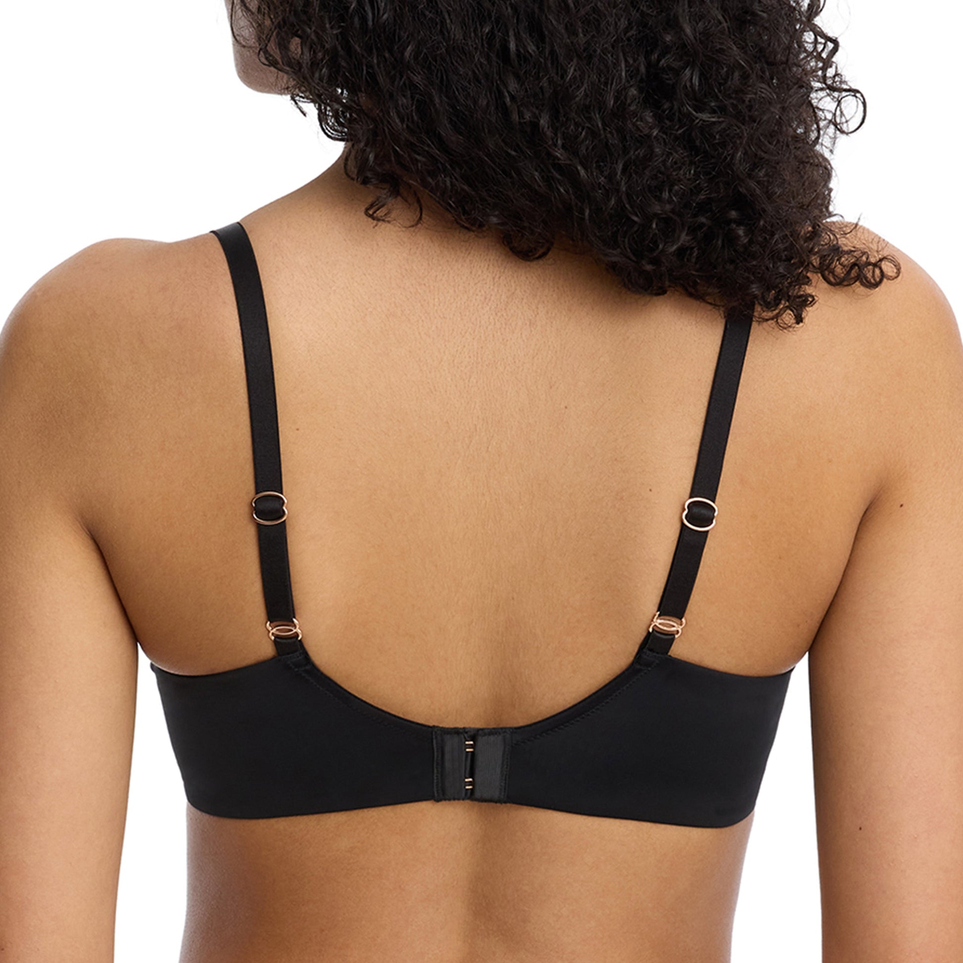Black bra worn by a person on a white background