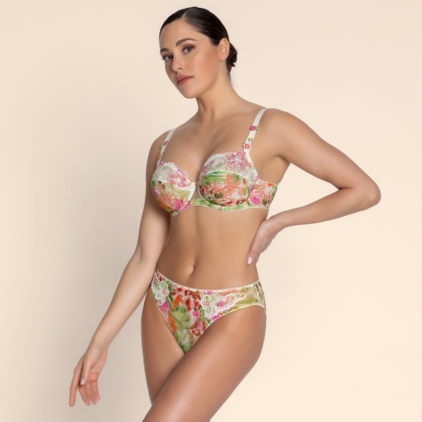 Woman wearing a floral bikini set on a beige background