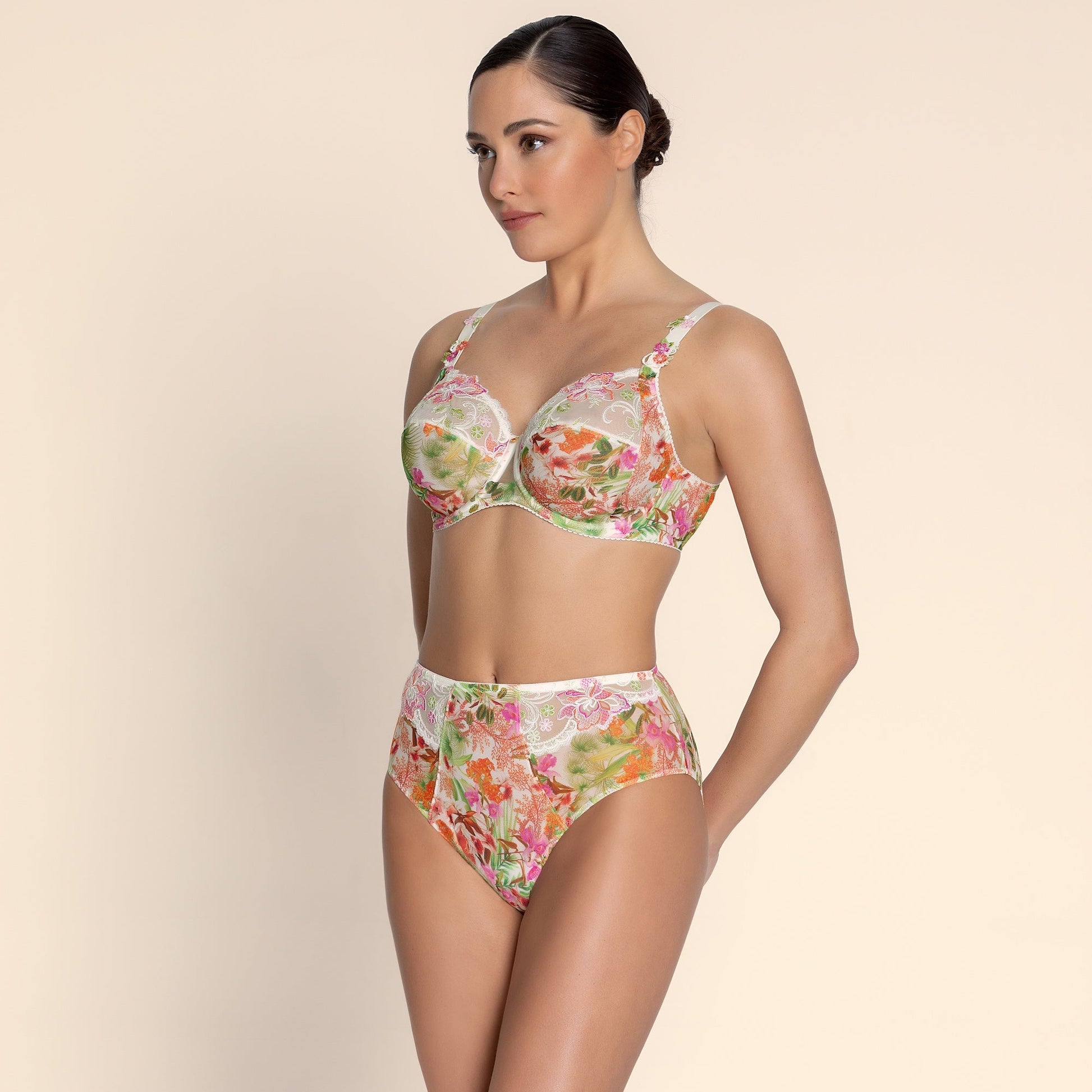 Woman wearing a floral bikini set on a beige background