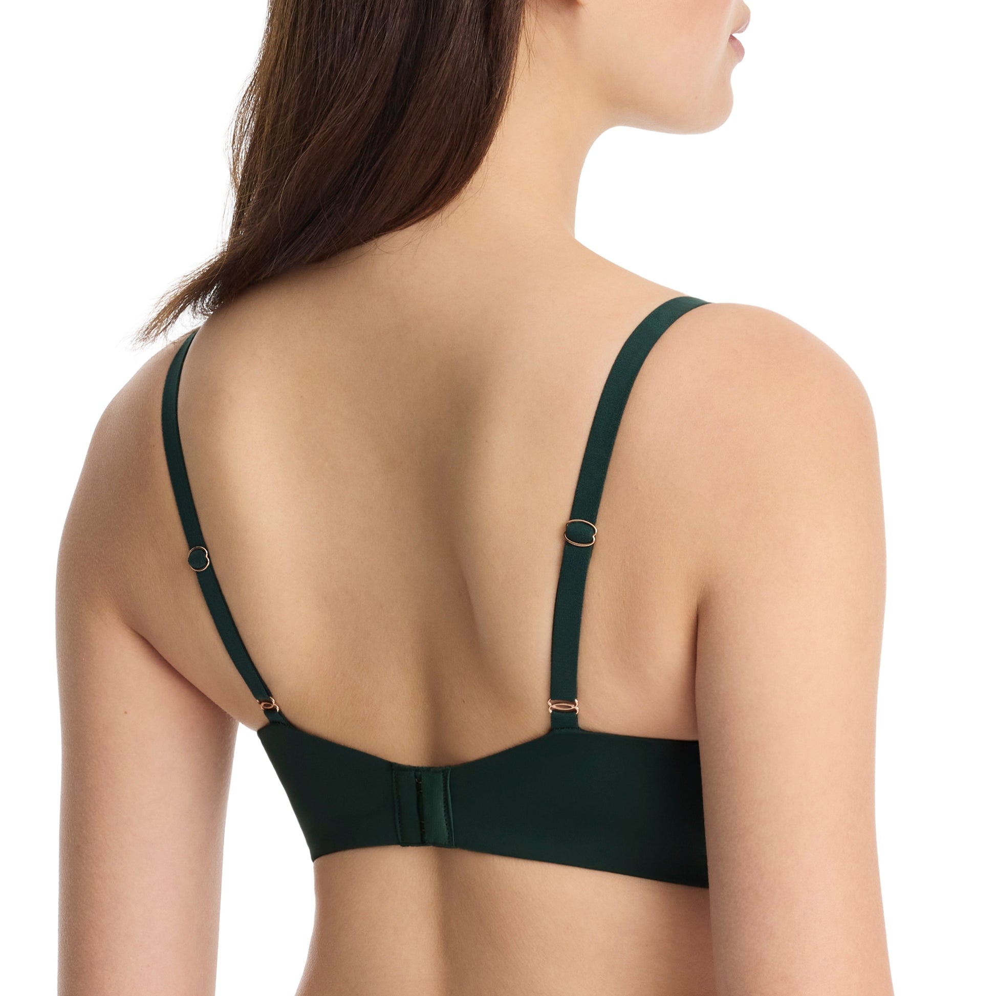 Green bra worn by a model on a white background