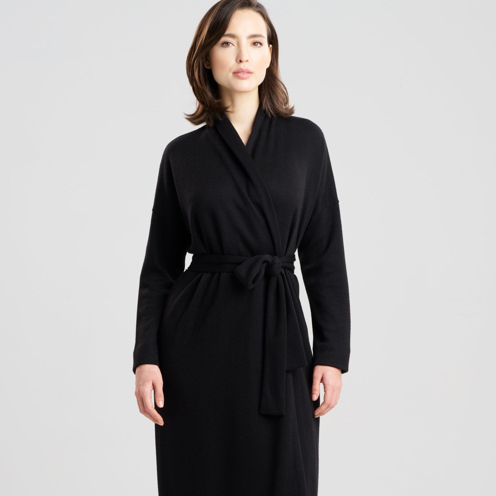 Woman wearing a black robe on a white background
