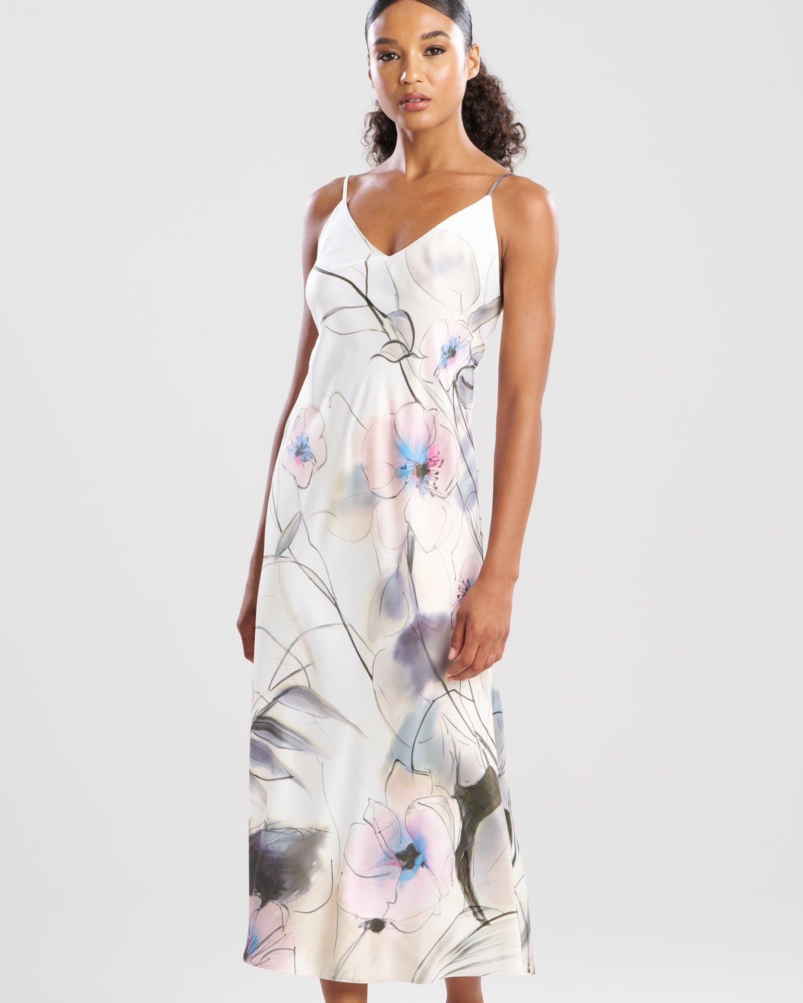 Woman wearing a floral dress on a white background