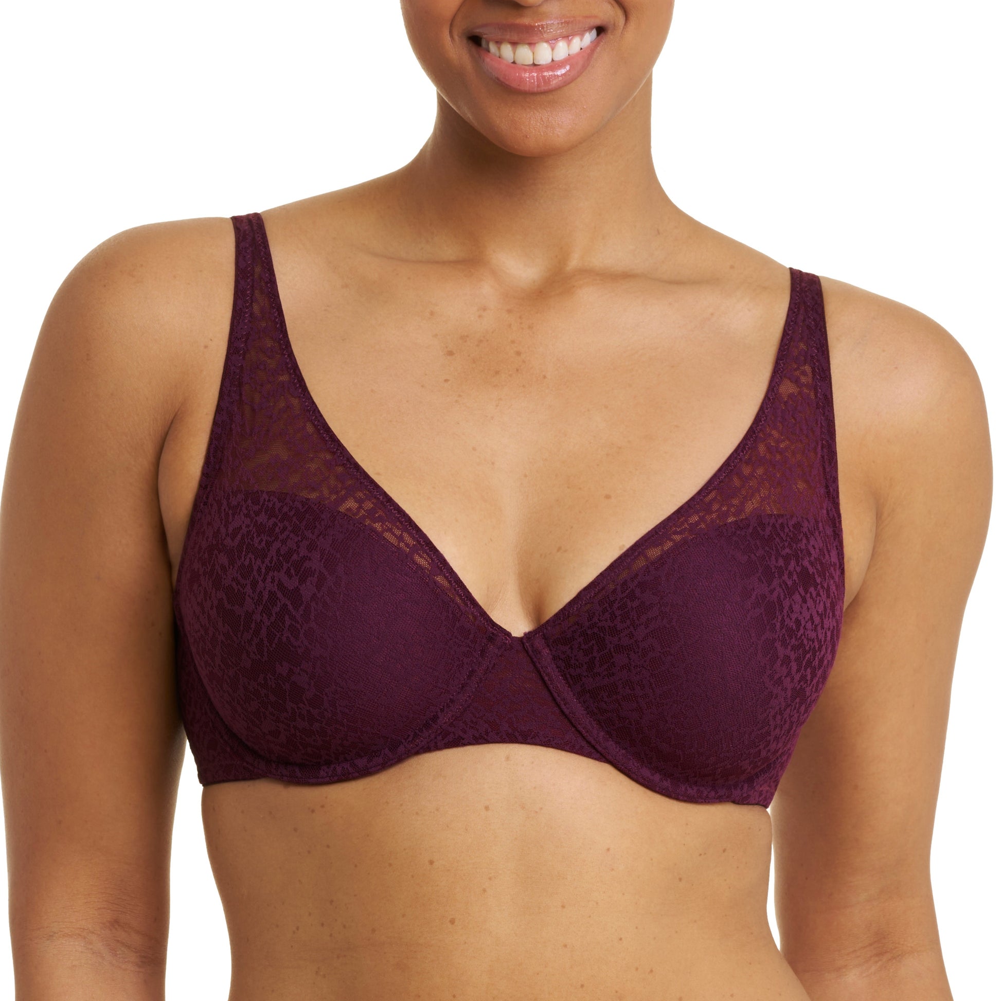 Woman wearing a purple bra and underwear set on a white background
